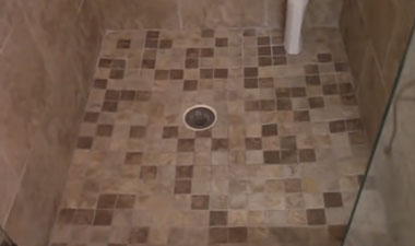 can a clogged shower drain cause a leak