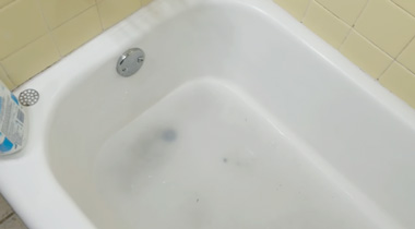 unclog bathtub drain with standing water