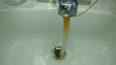 why brown water coming out of faucet and toilet